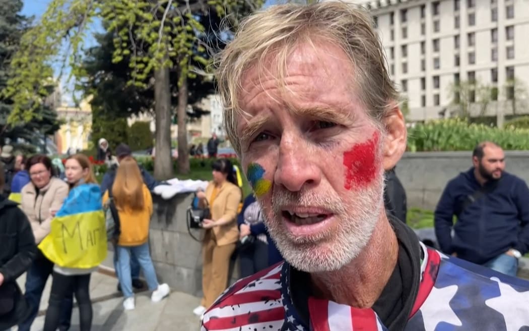 This screengrab taken from AFPTV on September 16, 2024 shows Ryan Wesley Routh speaking during an interview at a rally to urge foreign leaders and international organisations to help provide humanitarian corridors for the evacuation of civilians and Ukrainian servicemen from Mariupol in central Kyiv on April 27, 2022, amid Russia's invasion of Ukraine. US media said it was Routh, 58, who was arrested after US Secret Service agents "opened fire on a gunman" carrying an AK-47 style rifle near the boundary of Donald Trump's Florida golf course where the former president was golfing on September 15, 2024. (Photo by AFPTV / AFP)