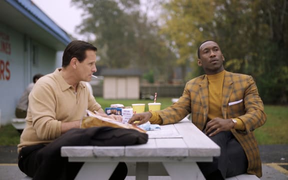 This image released by Universal Pictures shows Viggo Mortensen, left, and Mahershala Ali in a scene from "Green Book."