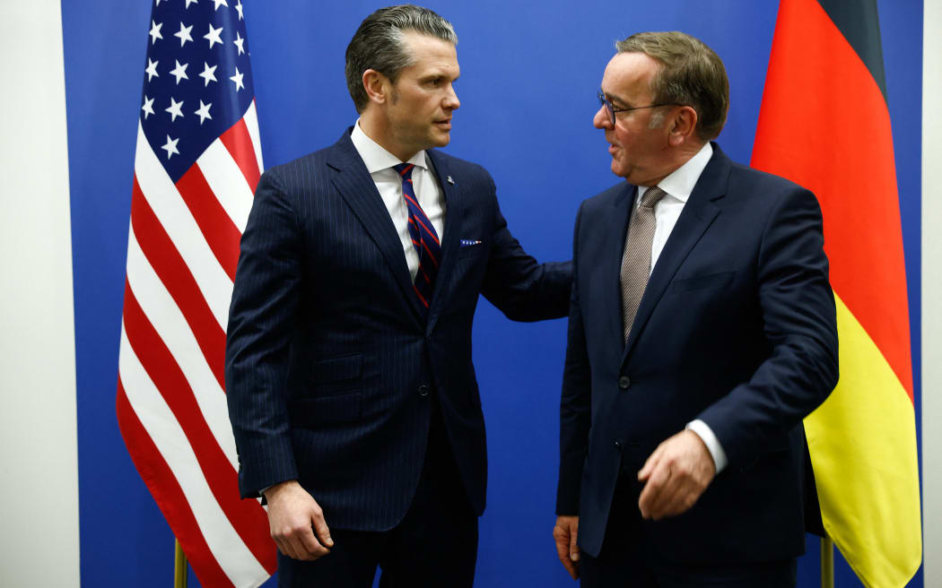 US Defense Secretary Pete Hegseth (L) stands with German Defence Minister Boris Pistorius, on the eve of a NATO defence ministers' meeting at the alliance's headquarters in Brussels, on February 12, 2025. (Photo by Johanna Geron / POOL / AFP)
