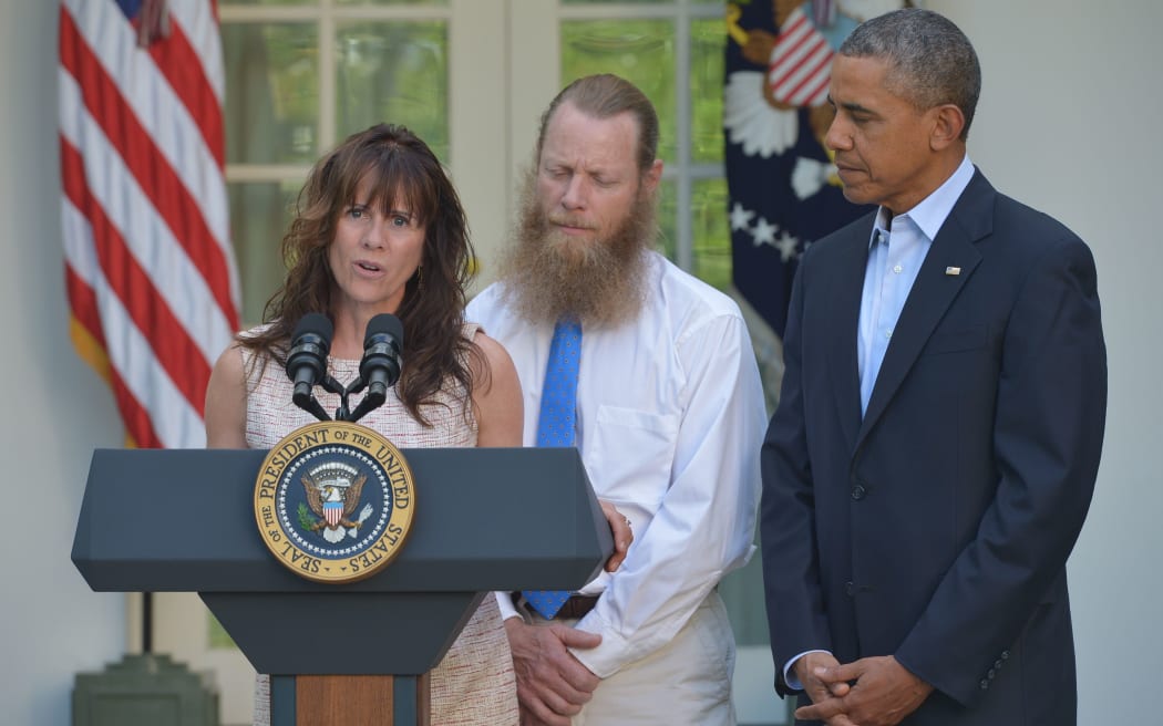 Mother of freed US soldier Bowe Bergdahl, Jani Bergdahl speaks to the media, while his father Bob Bergdahl and President Obama look on.
