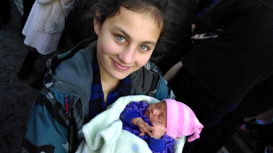Sisters Olivia Alice Prasad (one week, three days) and Shontel Pokipoki, 11, also attended today's event.