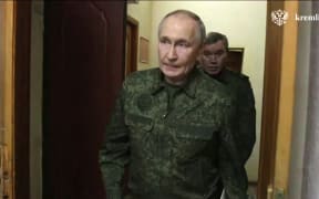 In this grab taken from a handout footage released by the Kremlin on March 12, 2025, Russia's President Vladimir Putin visits a command point for the Kursk group of troops involved in the counteroffensive in the Kursk region, amid the ongoing Russian-Ukrainian conflict. (Photo by Handout / KREMLIN.RU / AFP) / RESTRICTED TO EDITORIAL USE - MANDATORY CREDIT "AFP PHOTO / KREMLIN.RU / HANDOUT" - NO MARKETING NO ADVERTISING CAMPAIGNS - DISTRIBUTED AS A SERVICE TO CLIENTS