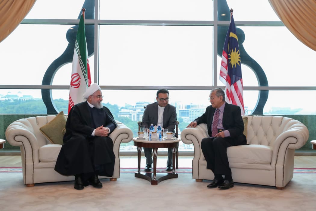 Iran's President Hassan Rouhani (L) meets Malaysian Prime Minister Mahathir Mohamad (R) in Kuala Lumpur, Malaysia.