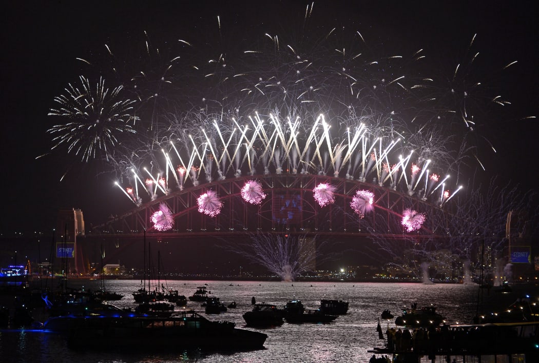 New Year's Eve fireworks erupt over Sydney's Harbour Bridge.