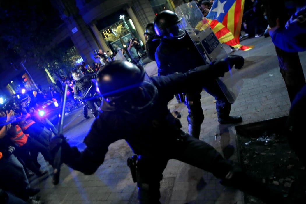 Police charge against protesters in the streets of Barcelona after the demonstration called freedom.