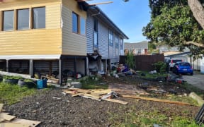 Two people died after a vehicle crashed into a house in Cannons Creek.