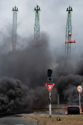Tyres are set on fire during protests in New Caledonia's capital, Noumea