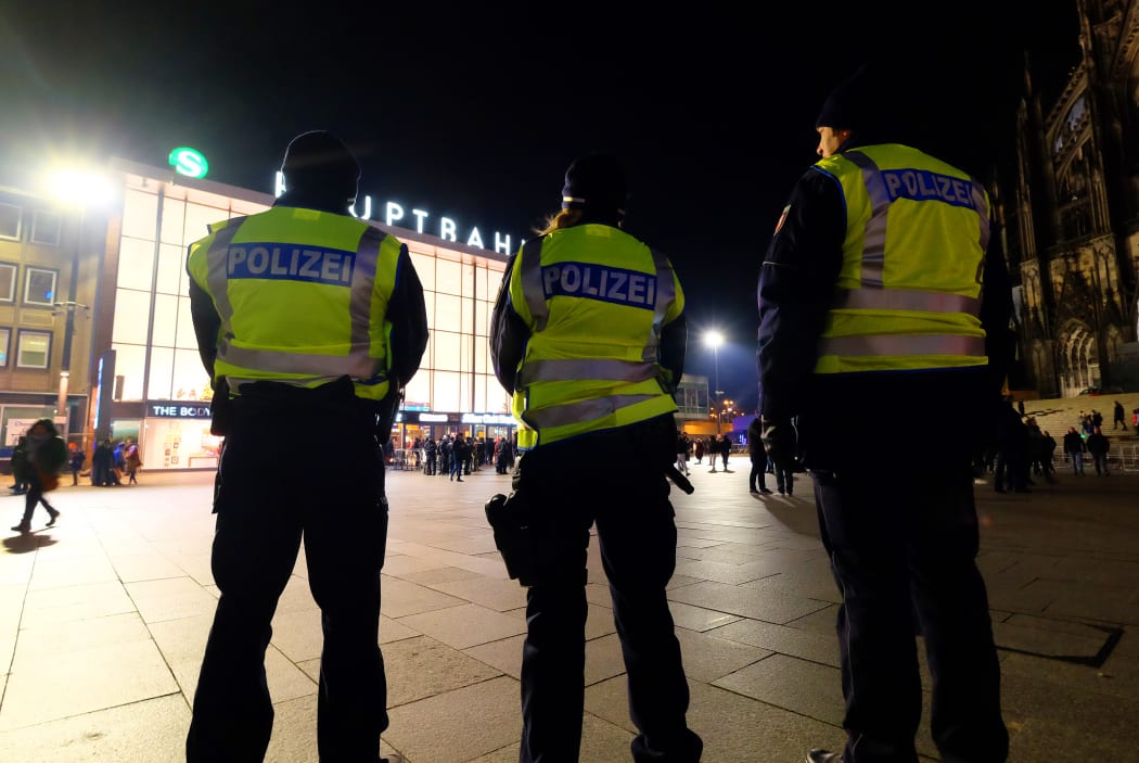 Police officers at the Cologne cathedral and main train station on 31 December 2016 during the New Year's eve.