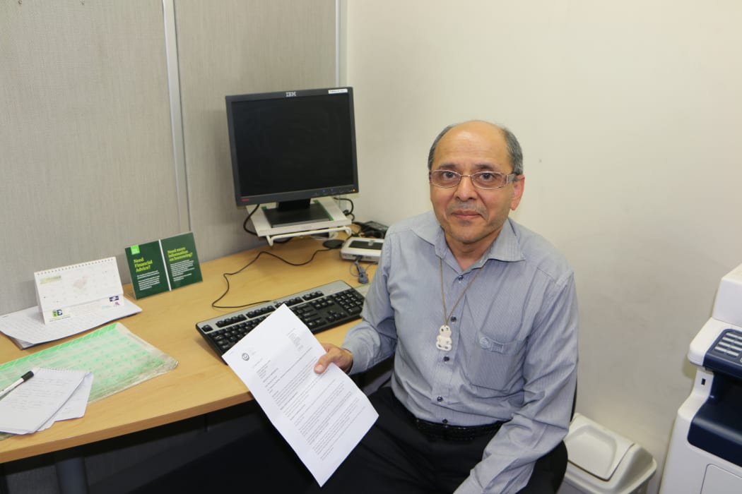 Bhaksar Desai with the letter he received from KiwiBank.