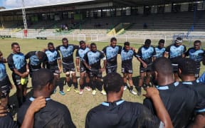 The Fijian Drua squad huddle together during training.