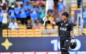 New Zealand's batsman Rachin Ravindra celebrates his century during the ICC Cricket World Cup 2023 match between New Zealand and Pakistan at the M. Chinnaswamy Stadium in Bengaluru.