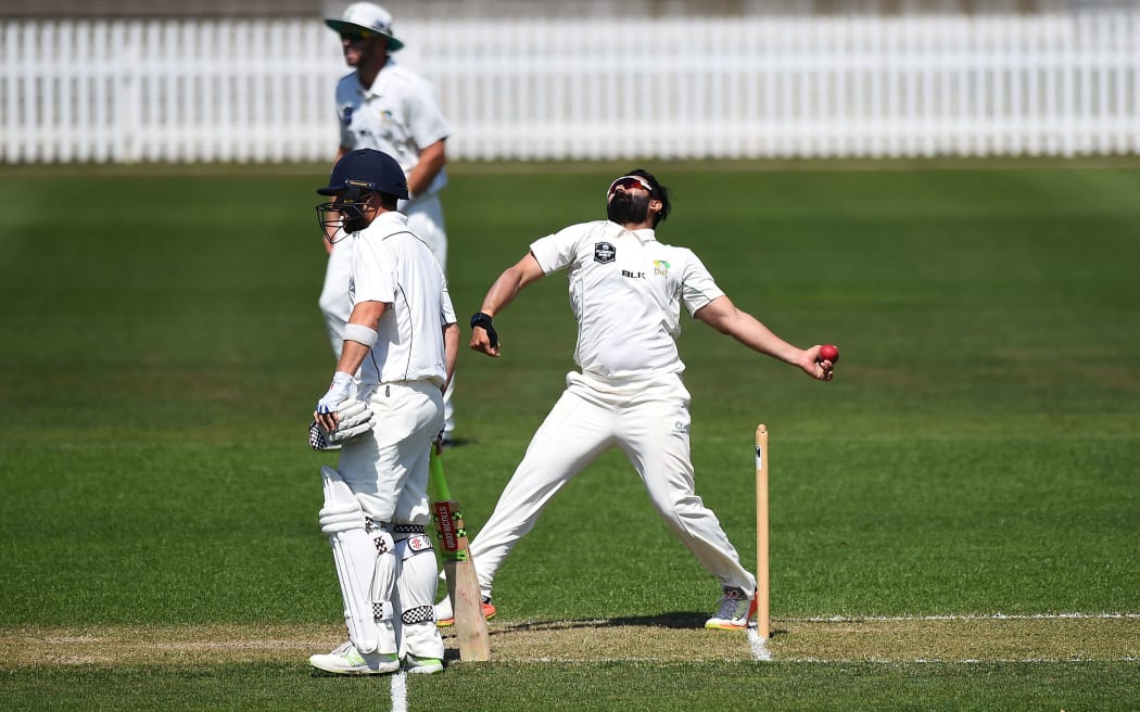 Ajaz Patel bowling for Central Districts.