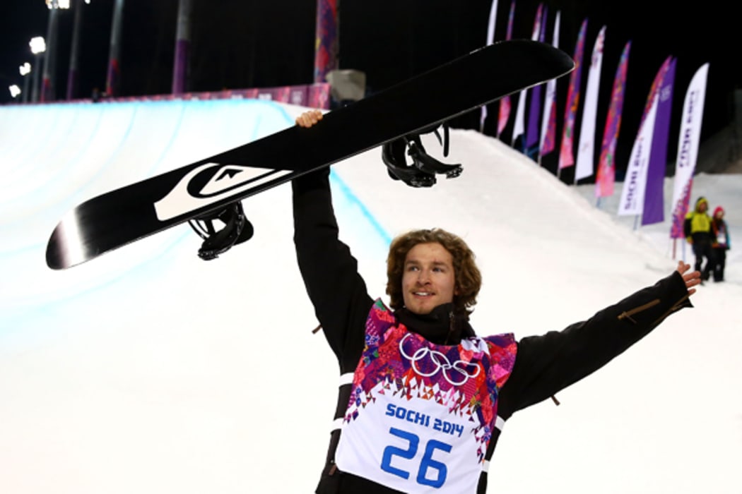 Snowboarder Iouri Podladtchikov celebrates winning a gold medal at the 2014 Sochi Winter Olympics.