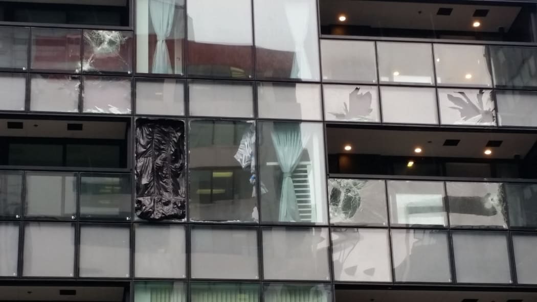 Building on Albert St with windows smashed from storm.