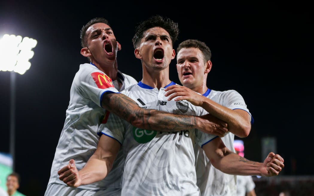 Logan Rogerson celebrates the equalising goal for Auckland FC against Adelaide United.