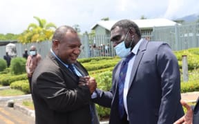 Papua New Guinea's Prime Minister James Marape (left) arrives in Arawa for talks hosted by Bougainville's President, Ishmael Toroama (right) 5 February, 2021.