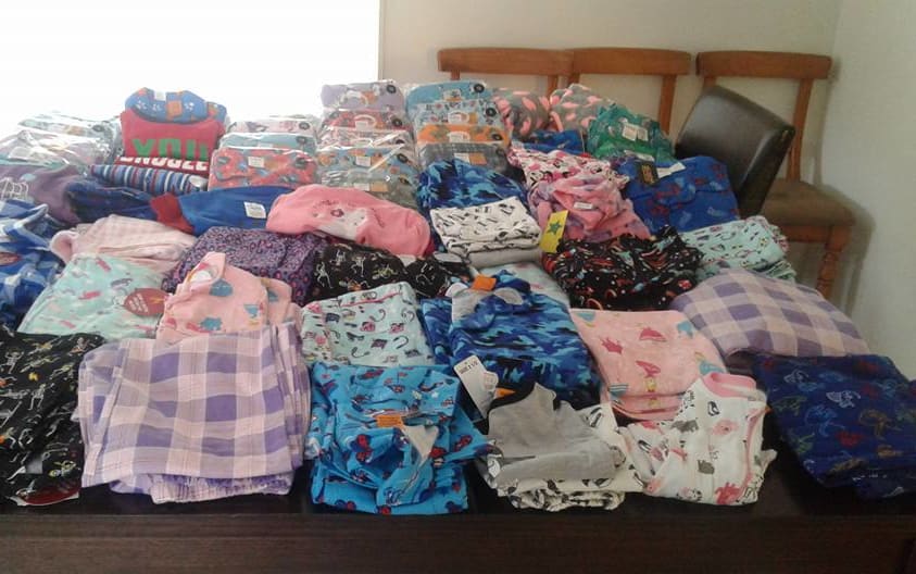 pyjamas folded on a bed