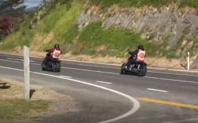 Gang members ride bikes in Ōpōtiki.