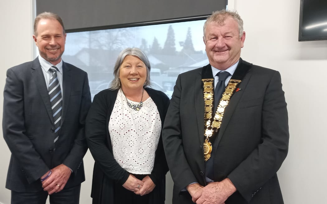 Ashburton's deputy mayor Liz McMillan, standing between chief executive Hamish Riach and Mayor Neil Brown, says the level of online abuse aimed at the council is increasing and the tone has changed.