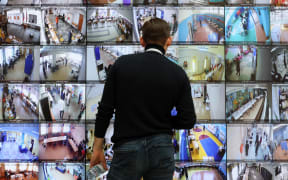 A huge screen broadcasting live feed from polling stations across Russia sits in the country's Central Electoral Commission (CEC) headquarters in Moscow on March 15, 2024, the first day of voting in the presidential election. (Photo by STRINGER / AFP)