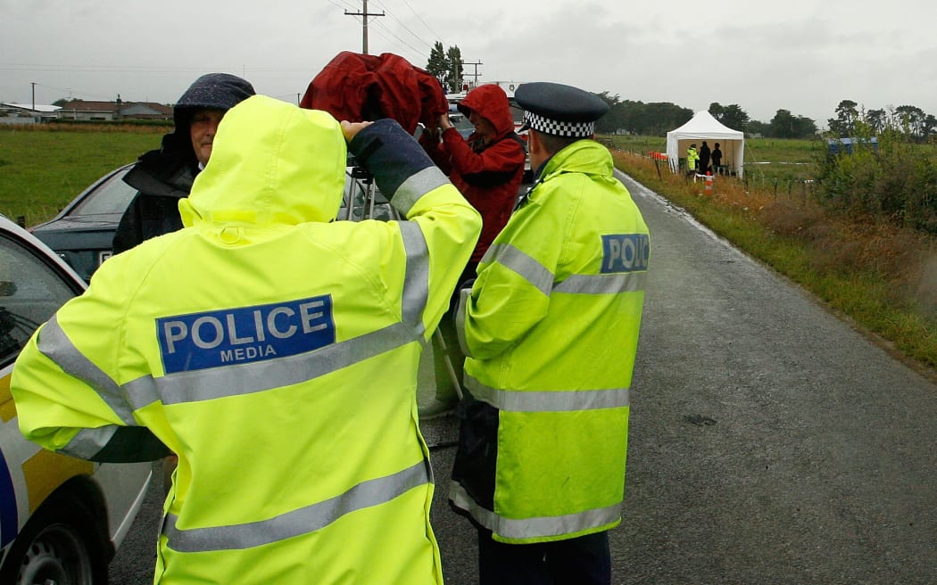 Policemen at the site of the crash near Carterton in 2012.