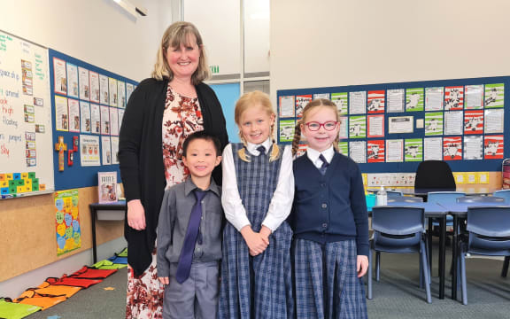 Farmer Time School programme. Teacher Brigid Ladley and some Year 2 students at St Michael's Church School