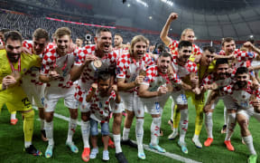Croatia's players celebrate with their medals after winning the Qatar 2022 World Cup third place play-off football match between Croatia and Morocco at Khalifa International Stadium in Doha on December 17, 2022. (Photo by JACK GUEZ / AFP)