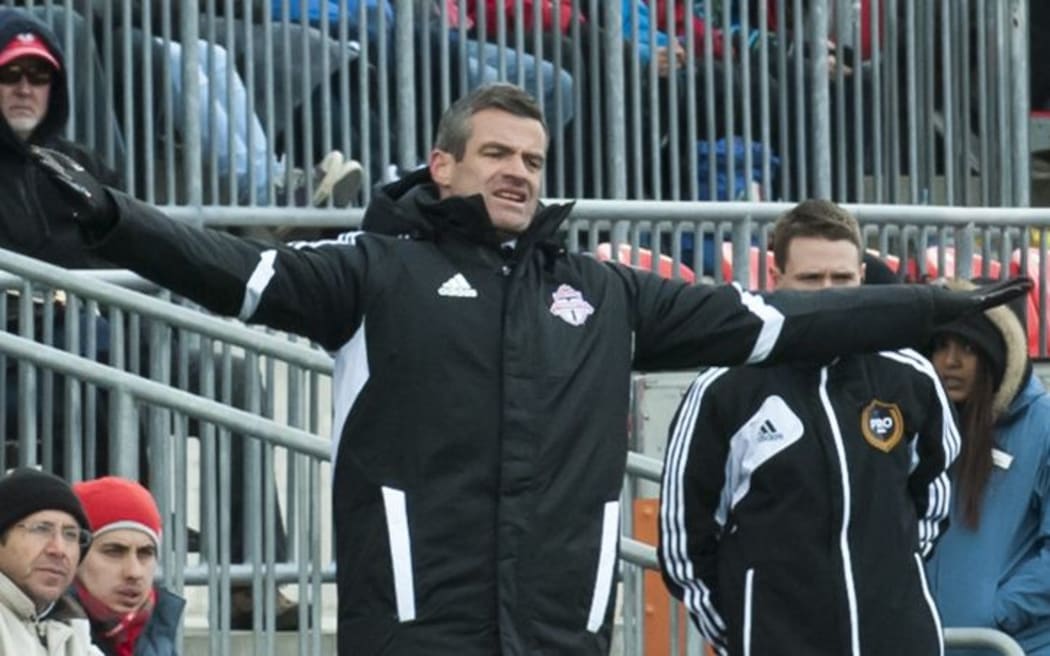 Toronto FC head coach Ryan Nelsen reacts after a play on the field.