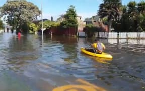 Nuffield Avenue residents say many people are still trapped in their homes by floodwaters.