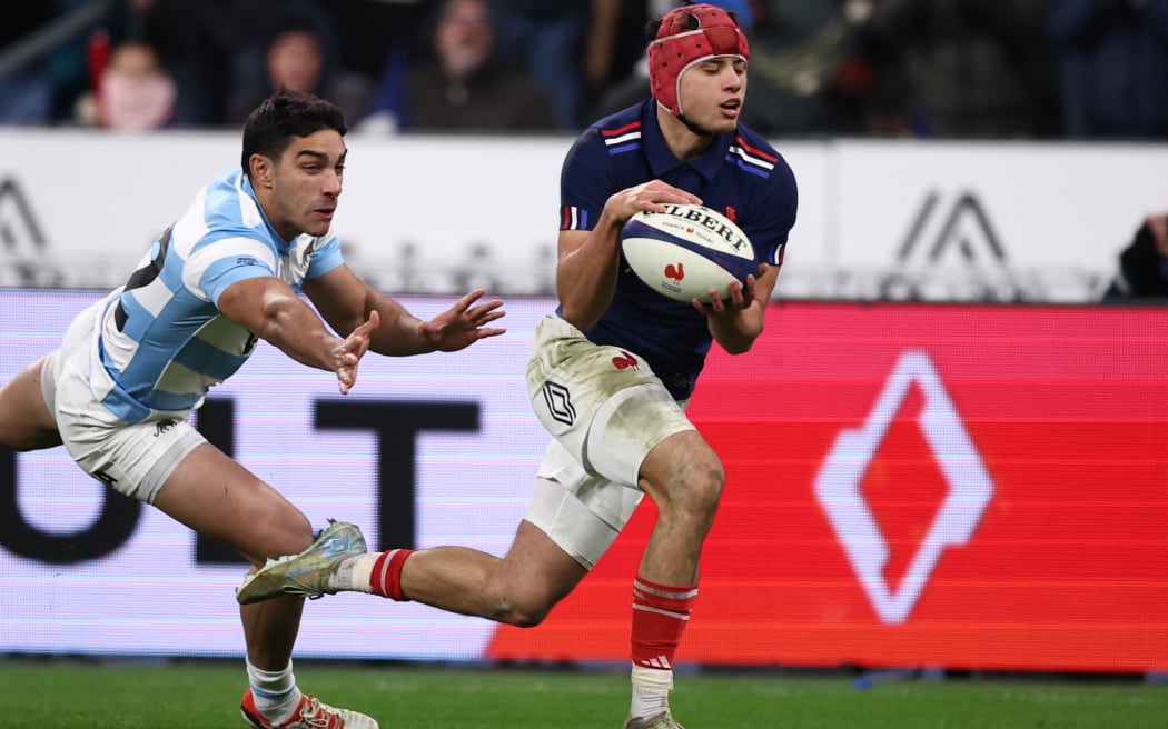 France's wing Louis Bielle-Biarrey goes in for a try in front of Argentina's centre Santiago Carreras during rugby's autumn series at the Stade de France in Paris.