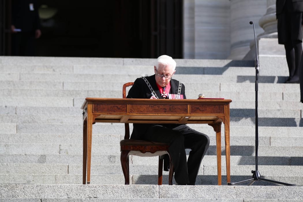 New Zealand Herald of Arms Extraordinary to the Queen Phillip O'Shea signs the proclamation dissolving the 51st Parliament.