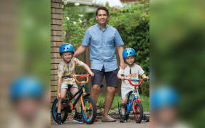 Simon Bridges with his sons in National's policy discussion document.