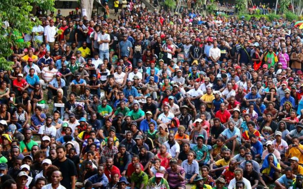 Students attend a rally at UPNG.