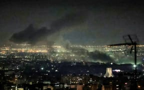 Smoke plumes billow from the site of airstrikes near Azadi Tower in western Tehran on March 10, 2026. The United States and Israel launched strikes against Iran on February 28, sparking swift retaliation by the Islamic republic which responded with missile attacks across the region. The war has dragged in global powers, upended the world's energy and transport sectors, and brought chaos to even usually peaceful areas of the volatile region.