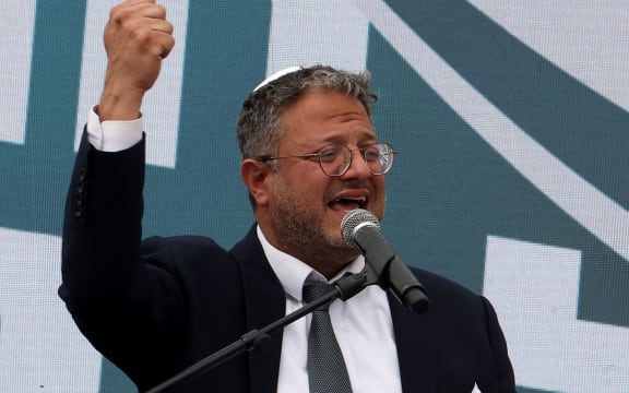 Israel's far-right National Security Minister Itamar Ben-Gvir delivers a speech during a rally in the outpost of Eviatar, near the Palestinian village of Beita, south of Nablus in the occupied West Bank, on April 10, 2023. Israelis marched in the northern West Bank, pushing for state approval of an Israeli settler outpost. Several ministers -- including Ben-Gvir -- were expected to appear at the march to Eviatar, whose residents agreed to leave in 2021 while officials examined their case. (Photo by GIL COHEN-MAGEN / AFP)