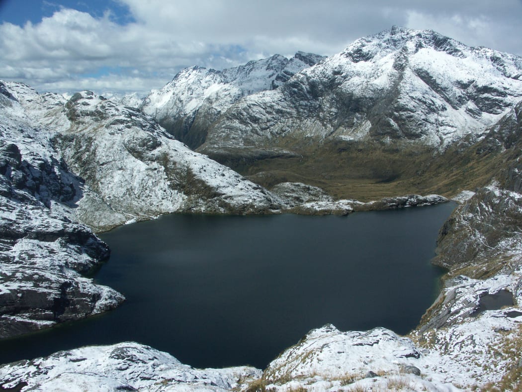 Lake Harris after a snowy day. Taken from the path from Harris saddle to Conical Hill.