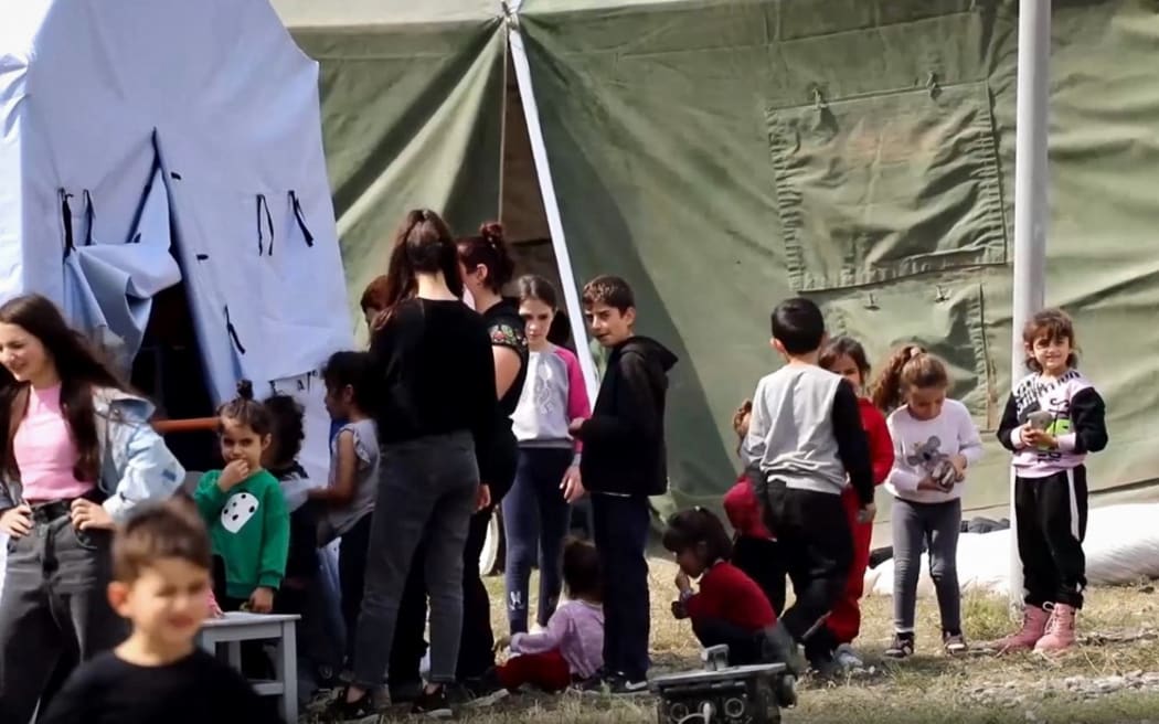 Armenian civilians at a makeshift camp settled at Russian military base near Stepanakert in the Nagorno-Karabakh region.