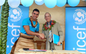 Pita Taufatofua (left) and UNICEF Pacific Representative, Sheldon Yett
