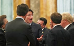 Britain's Princess Anne, talks to Canadian Prime Minister Justin Trudeau, (3L) and Britain's Prime Minister Boris Johnson (R), France's President Emmanuel Macron (2R - back to camera) and NATO Secretary General Jens Stoltenberg .