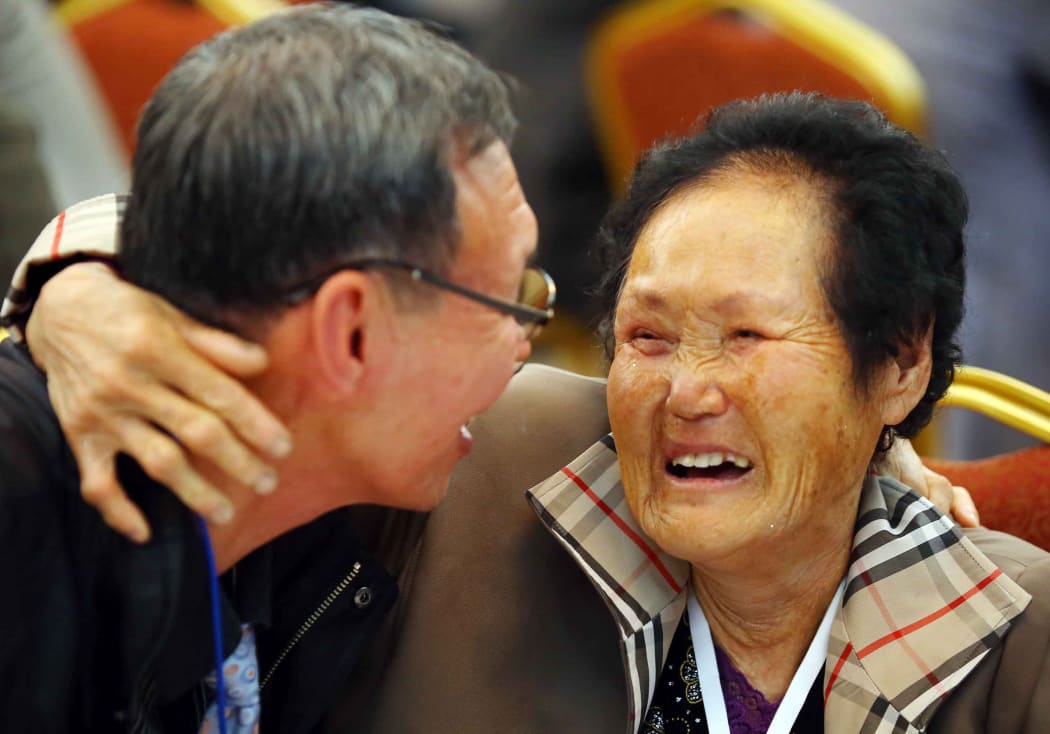 South Korean Lim Chung-Hwan, 72, left, hugs with his North Korean relative Rim Ok-Rye, 82, right.