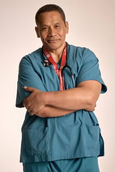 Dr Timoti Te Moke in scrubs.