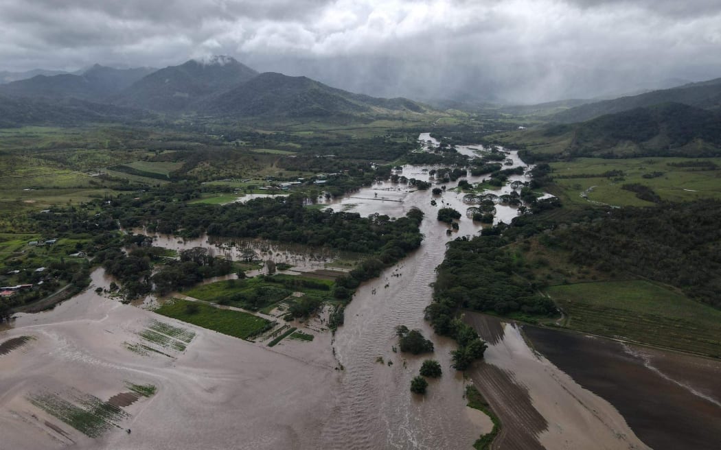 river overflowing in crop areas.