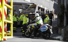 Emergency services gather on Church street in Wellington after reports of an injury in an apartment explosion.