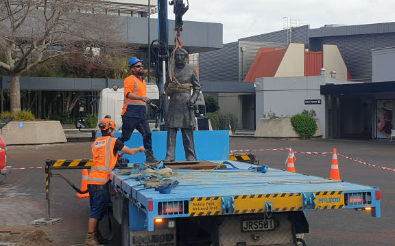 The statue of Captain John Fane Charles Hamilton being removed.