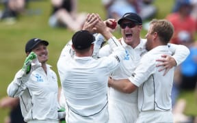 Martin Guptill celebrates taking a catch on day 3 of the 2nd cricket Test against Sri Lanka at Seddon Park in Hamilton, New Zealand. Sunday 20 December 2015. Copyright photo: Andrew Cornaga / www.photosport.nz