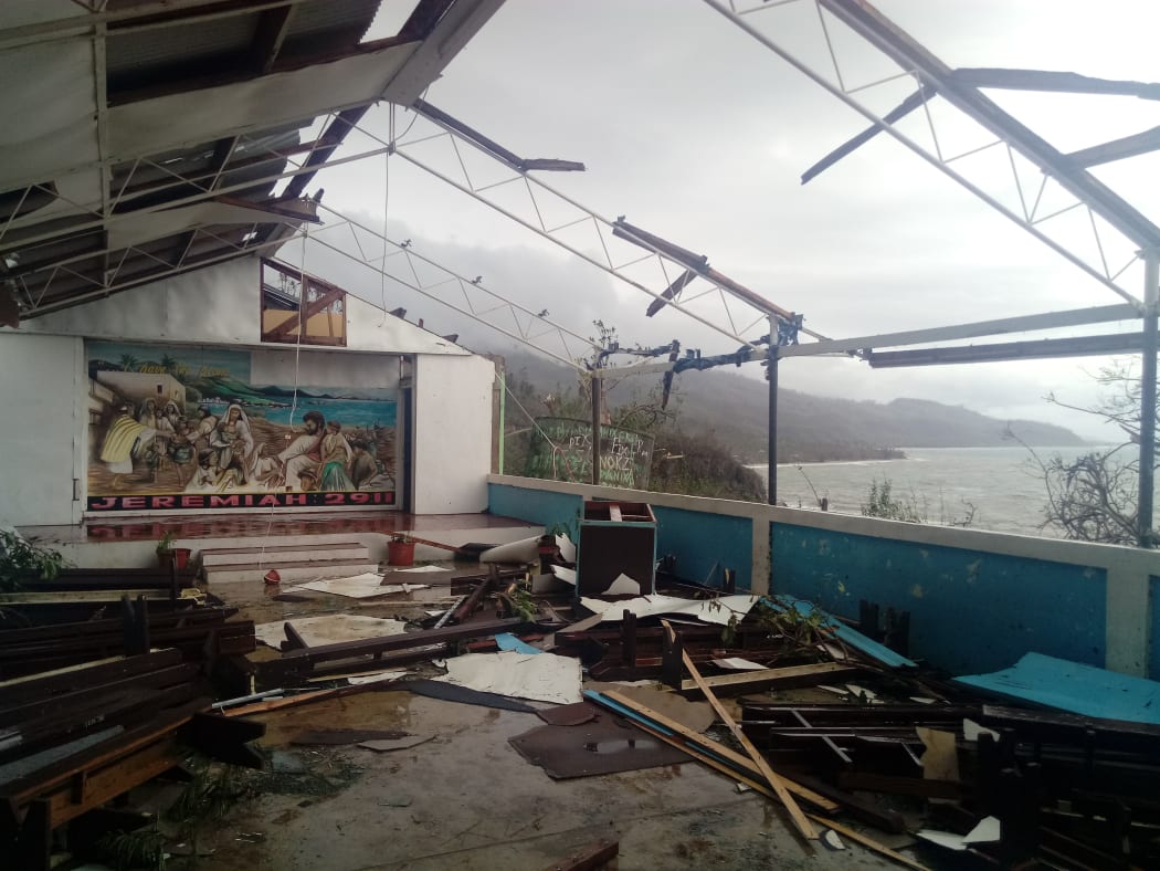 A damaged chapel in Ranwadi Secondary School overlooks a devastated Pentecost landscape.Cyclone Harold, Vanuatu 2020.