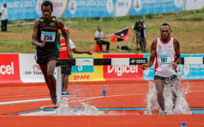 Charley Simon (L) won his second gold medal of the Mini Games in the men's 3000m steeplechase.