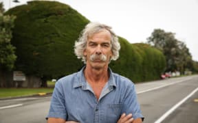 The hedge on Te Moana Road was planted by Vincent Osborne's grandfather in the 1930s, and has been in his family for four generations, neighbors and Kāpiti Coast District Council are concerned it is a traffic hazard. Pictured: Vince Osbourne.