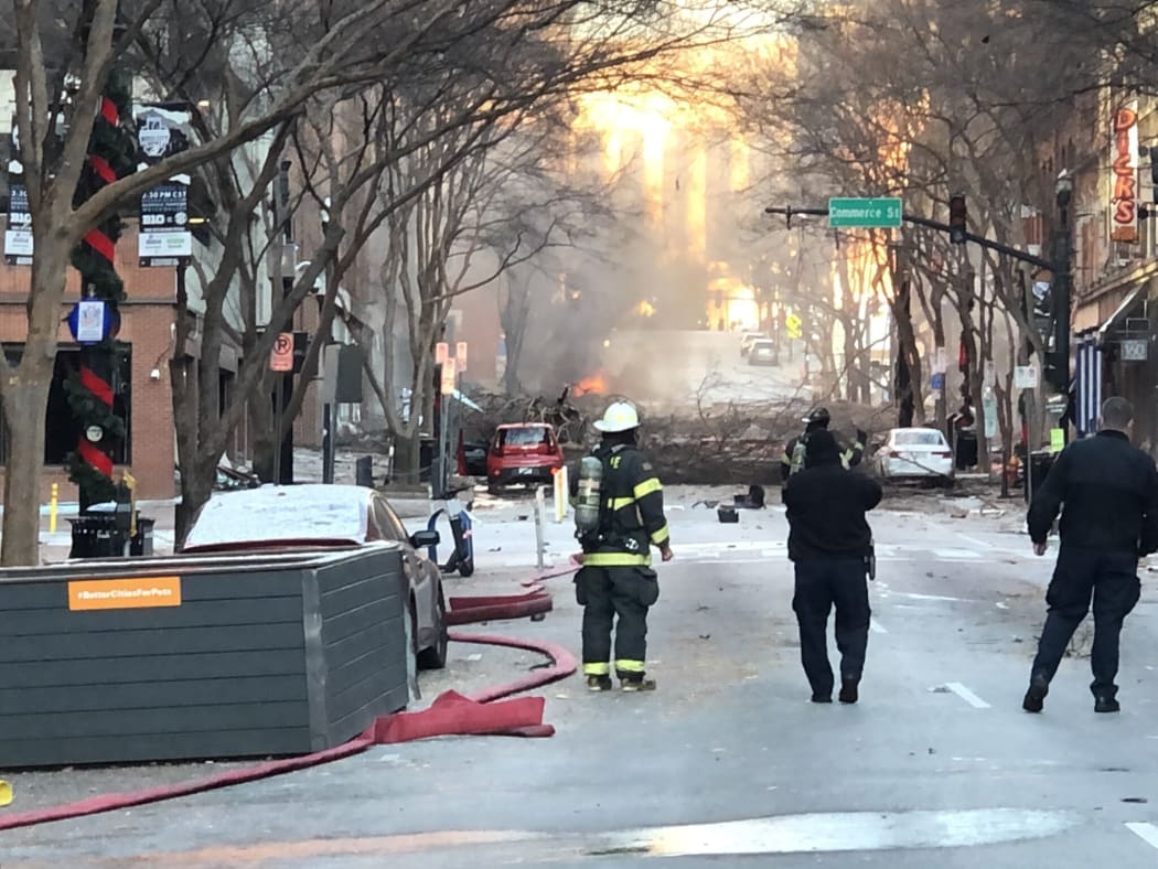 Nashville Fire Department staff on a street damaged after an explosion in Nashville, Tennessee on 25 December 2020.