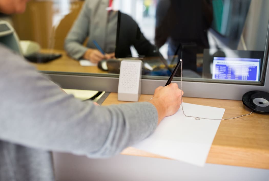 A customer at a bank.